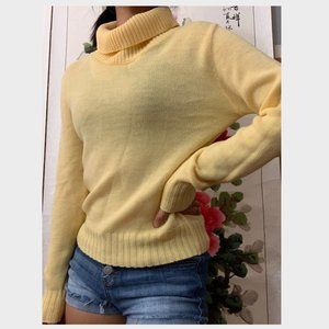 Bright yellow turtleneck sweater